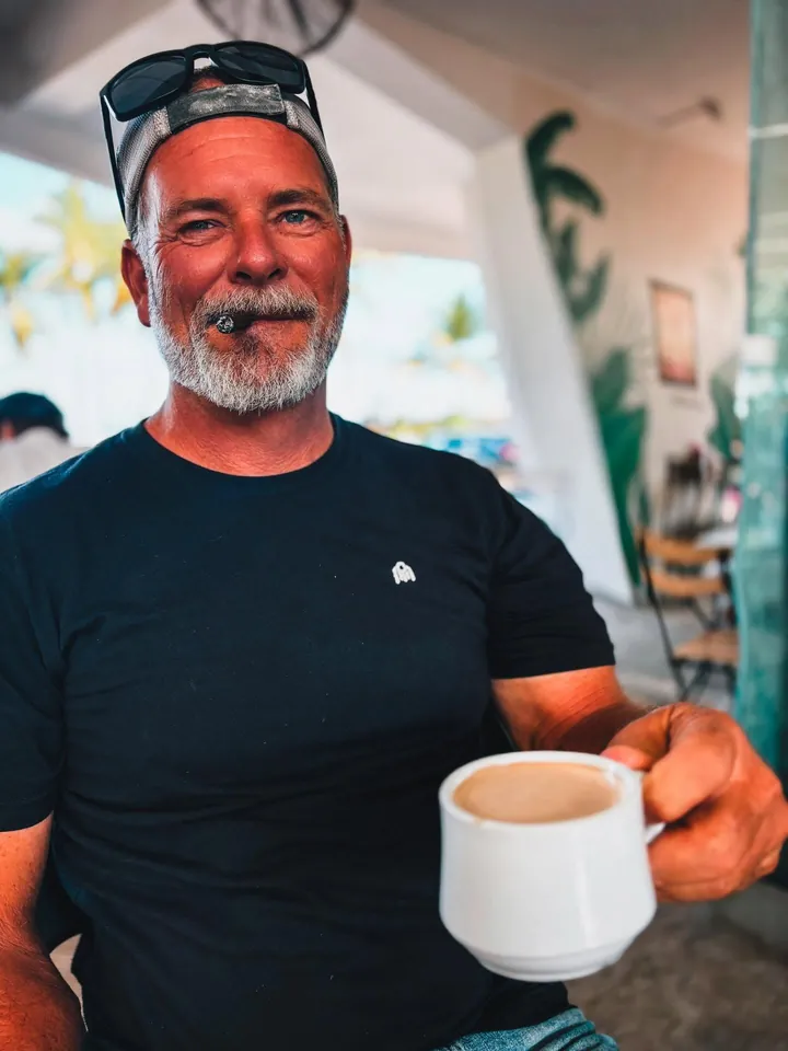 David with a cigar and a cup of coffee