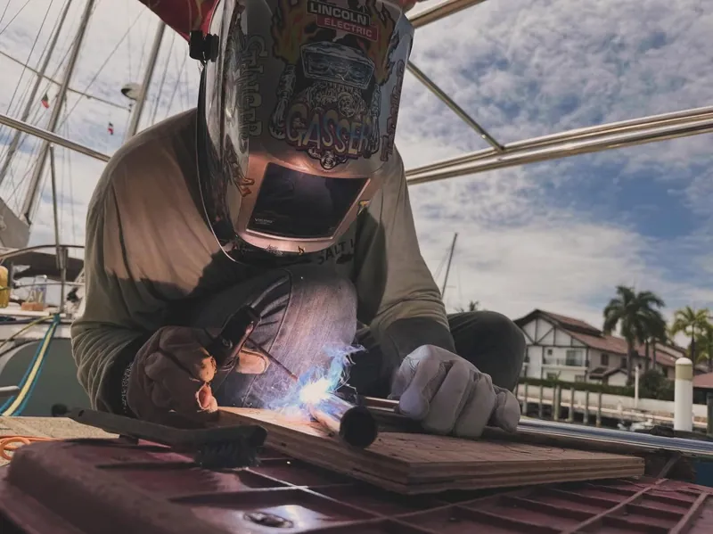 David welding on the deck of the sailboat