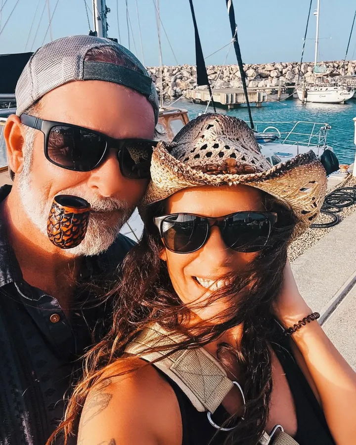 David with his pipe and Mel in her straw hat at the marina