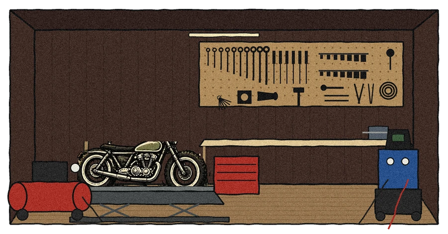 Drawing of inside the Toolbox: a pegboard of moto tools, a workbench, a motorcycle lift, an air compressor and a welder